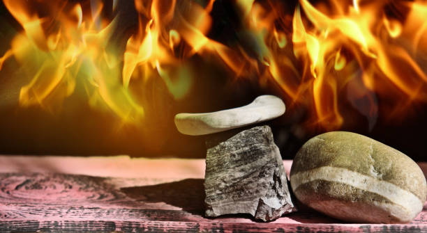 Empty stone podium on flaming fire background in dark. Hot and flame. Background for design. Space for presentation product