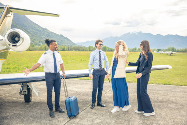 istock Young business people boarding private jet 1488109964