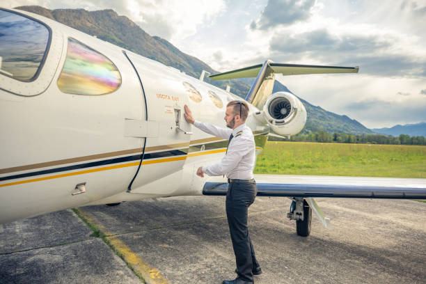 istock Male pilot opening private plane door 1488110292