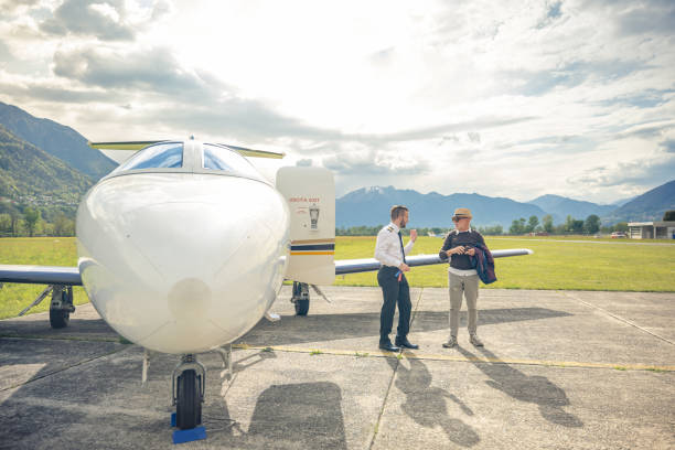 istock Businessman disembarking from private plane 1488110524