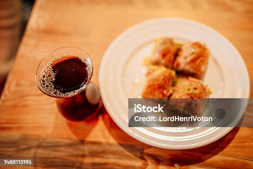 istock Turkish tea in a traditional teacup with Turkish delights baklava 1488113195