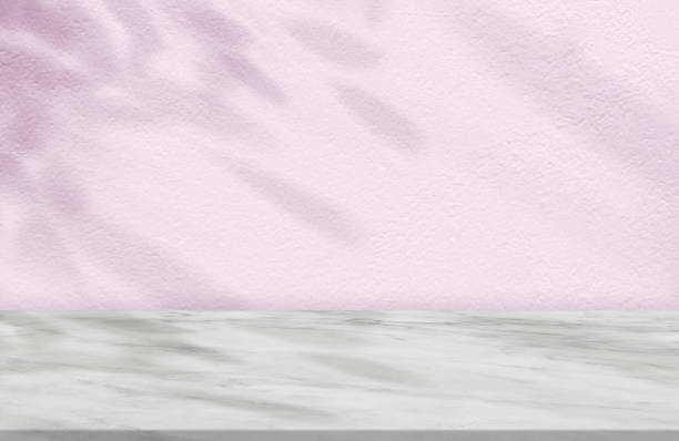istock Pink Concrete Wall Texture with Leaves Shadow on Marble floor Background,Empty Cement Studio Room with Marble Top,Backdrop background Spring,Summer Cosmetic Product Display,Mockup Presentation 1488113566
