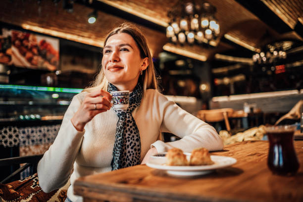 istock Young woman drinking traditional Turkish coffee 1488115080