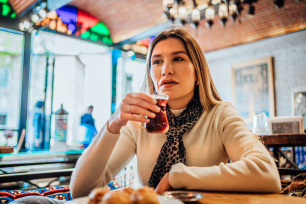 istock Young woman drinking traditional Turkish tea 1488115474