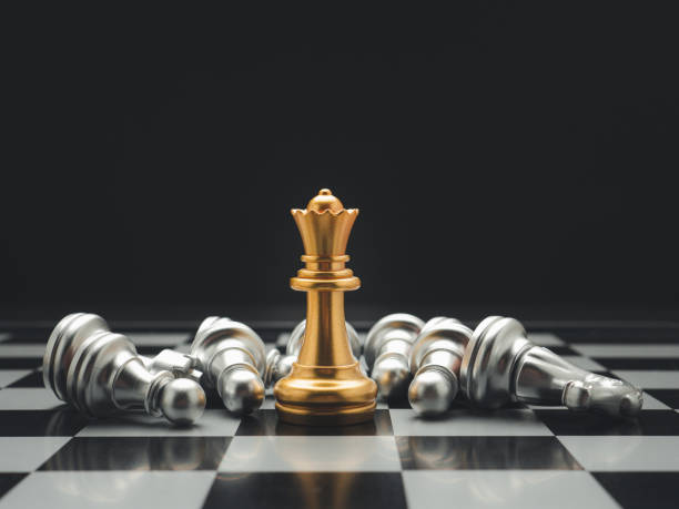 istock Chess pieces on board game planning and competition on black background. 1488116680