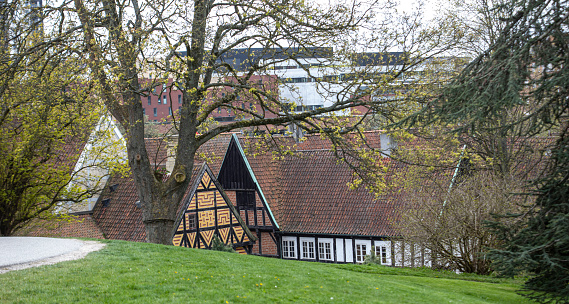 Oslo, Norway: Rådmannsgården, build in 1626 for for councilor (Rådmann) Lauritz Hansen, the oldest preserved building in the old Christiania, made of imported Dutch brick - the building has steep roof with high gables with blind arcades. Presently the Oslo Art Society headquarters. To the left the Anatomygården, dating from the 18th century - Christiania Torv, Rådhusgata and Nedre Slottsgate - Kvadraturen area.