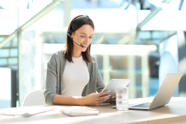 istock Woman customer support operator with headset and smiling 1488120403