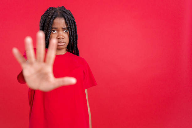 istock African woman gesturing prohibition and stop with hand 1488121354