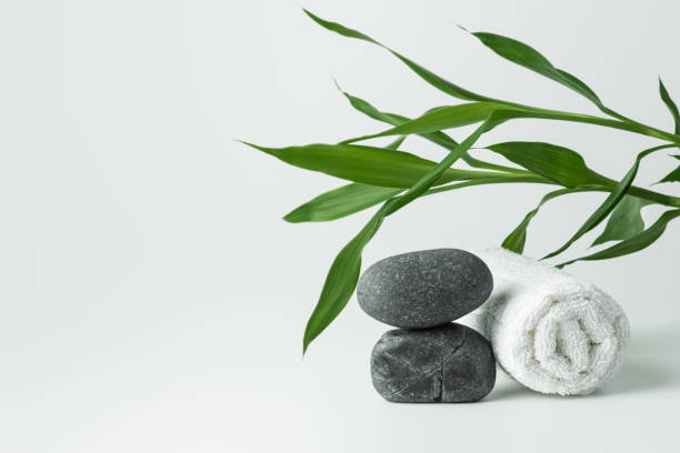 istock Light gray background with stones, towel and bamboo. 1488121930