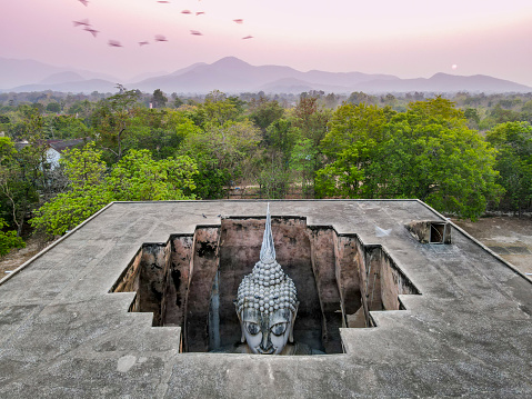 Drone point of view of Buddha in Wat Si Chum, Sukhothai, Thailand