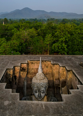 Drone point of view of Buddha in Wat Si Chum, Sukhothai, Thailand