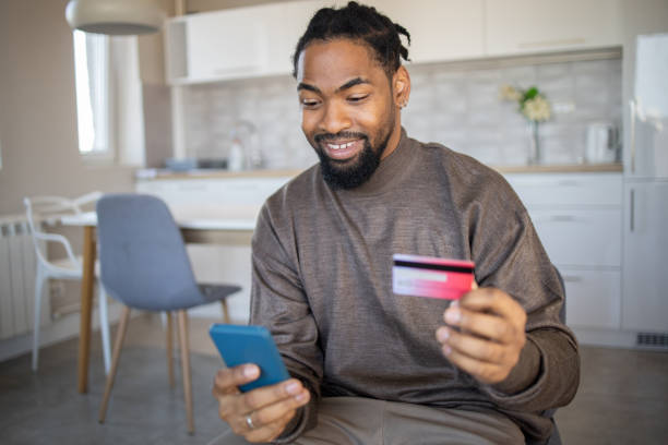 istock Man using her credit card to shop online 1488124697