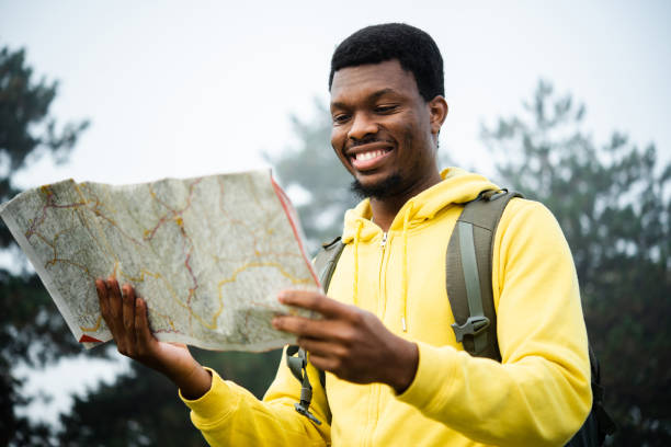 istock African American tourist exploring the map 1488124805
