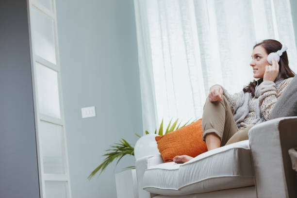 istock Wearing white headphones 1488125206