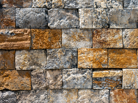 Surface of the stone wall for background and wallpaper