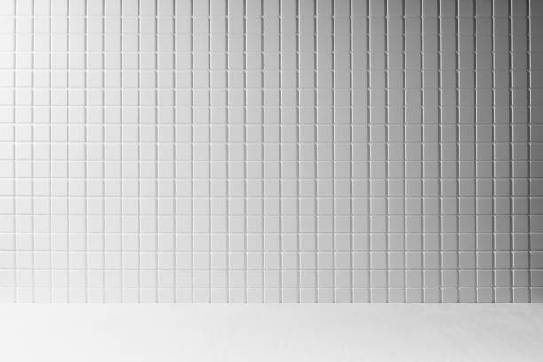 istock White abstract scene mockup with white tiny tile wall, grey gradient, wood surfase as floor for display, presentation of cosmetics products, goods, design. Elegant stage in summer mediterranian style. 1488127089