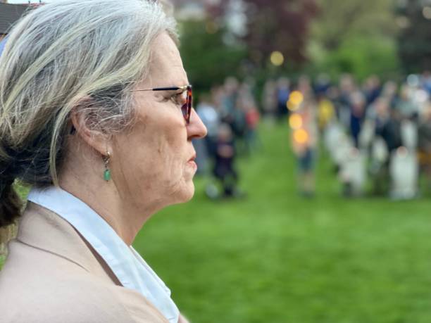istock Woman watching the Ceremony Lest we Forget 1488127999