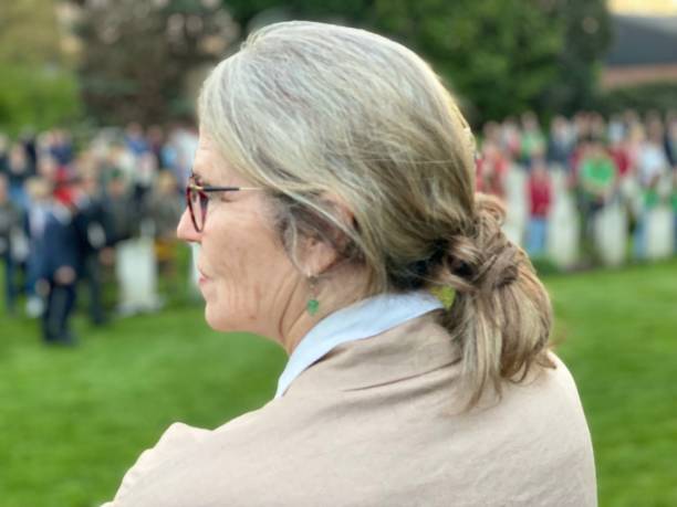 istock Woman watching the Ceremony Lest we Forget 1488128000