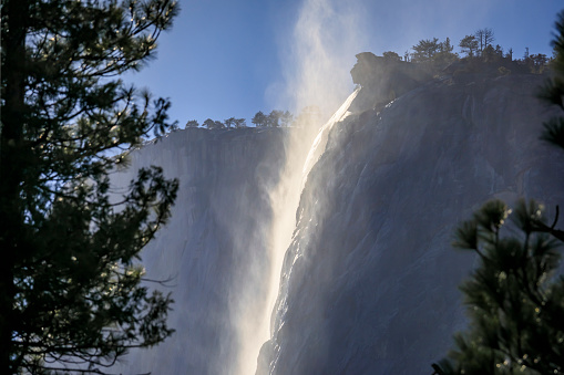 Scenic view of the famous Horsetail Falls with rising mist in the Yosemite National Park, Sierra Nevada mountain range in California, USA
