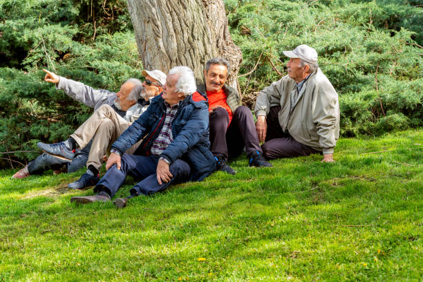 istock Active Senior Old Friends Having A Nice Day At  Park. Sitting, Resting. 1488130760