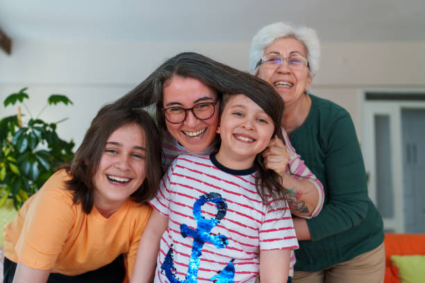 istock Happy Multi Generation Family looking at camera 1488132980