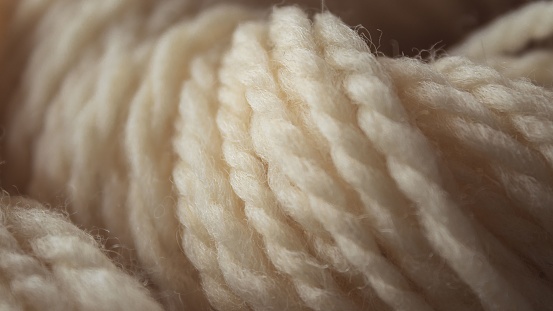 Closeup of a soft yarn of beige thread