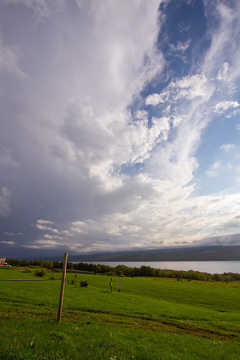 Dramatic clouds over lake at sunset.