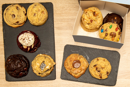 A dessert set of assorted cookies with chocolate chips and nuts