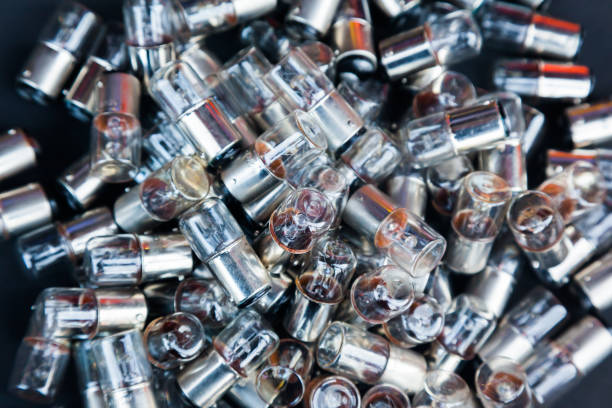 istock Many small incandescent bulbs lie in a heap, close-up. 1488136748