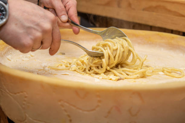 istock Traditional Italian spaghetti soaked inside a grana padano cheese 1488136842