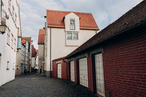 Beautiful old wooden beam houses with white and orange plaster. Fishermen's Quarter. Ulmer Stadtmauer. Fachwerk. Ulmer Muenster