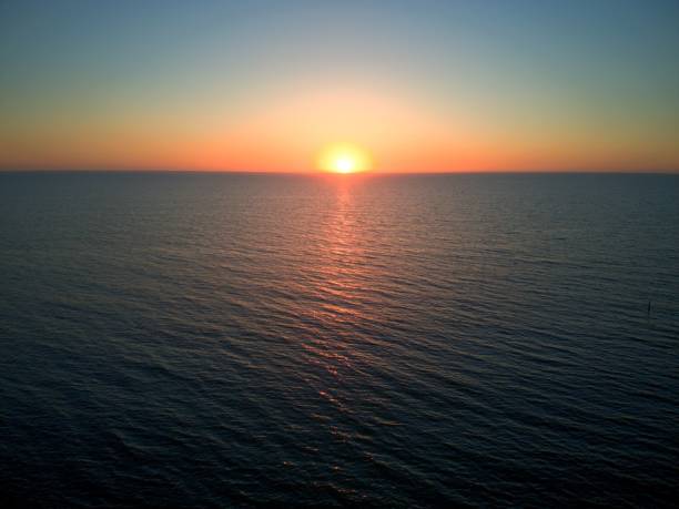 istock Scenic view of sunset over a tranquil sea 1488136927