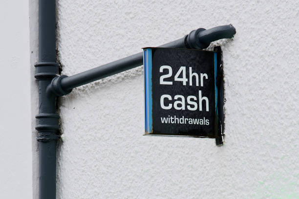istock 24 hour cash withdrawals sign on wall above ATM machine 1488139037