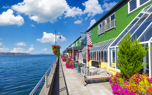 Panoramic view of Seattle Bell Harbor Marina and Seattle harbor piers and restaurants.