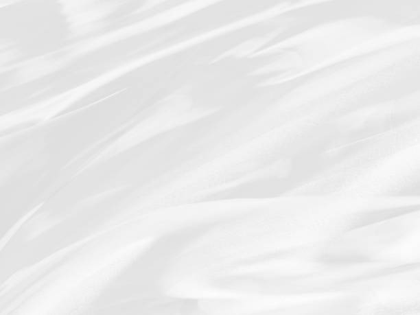 istock fashion soft fabric Clean textile woven beautiful abstract smooth curve shape decorative white background 1488140049