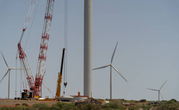 wind turbine - a large crane works on the construction of a wind turbine - aero imagens e fotografias de stock