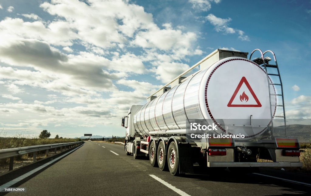 Transportation of flammable material by road. Tanker truck for transporting hazardous chemical materials by road. Truck Stock Photo