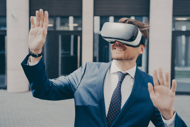 istock Successful video game publisher wearing black and white VR headset while standing outside 1488143265