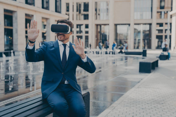istock Young business owner in blue formal suit reviewing projects in virtual reality 1488143323