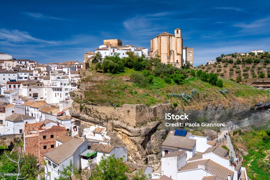 Setenil de las Bodegas. Typical Andalucian village with white houses and sreets with dwellings built into rock overhangs above Rio Trejo Setenil de las Bodegas. Typical Andalucian village with white houses and sreets with dwellings built into rock overhangs above Rio Trejo. Setenil Stock Photo