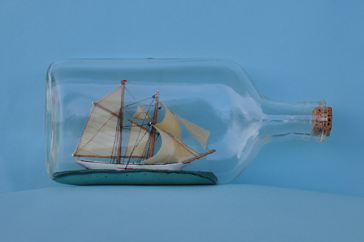 vintage impossible bottle sailing ship with masts and sails