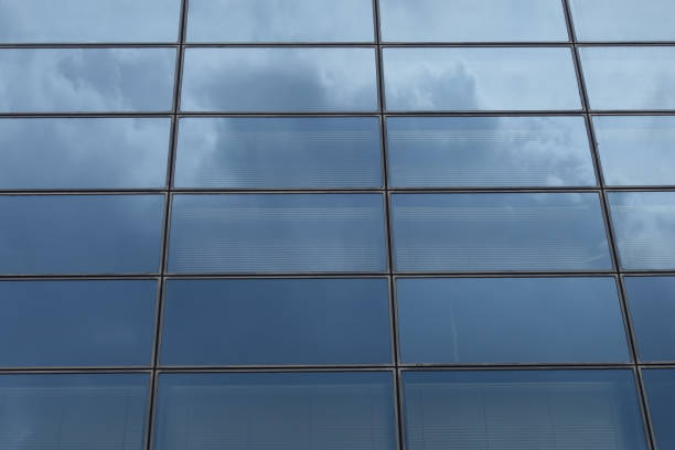 istock glass facade of modern building with sky reflections abstract background 1488144967