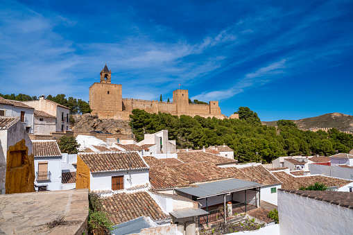 Antequera town in Andalusia. Old city homes and Alcazaba on a beautiful sunny day.