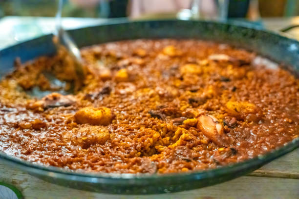 A Paella plate at spanish restaurant, night view.
