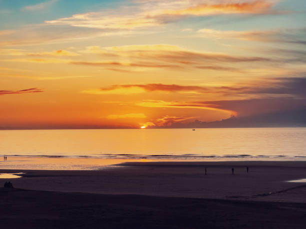 Amazing sunset over the calm water North Sea.