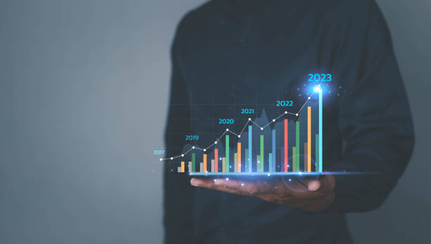 istock Businessman plan graph growth and increase chart positive indicators in his business,tablet in hand. challenge and business strategy graphs and target of business gain profits in 2023. 1488150267