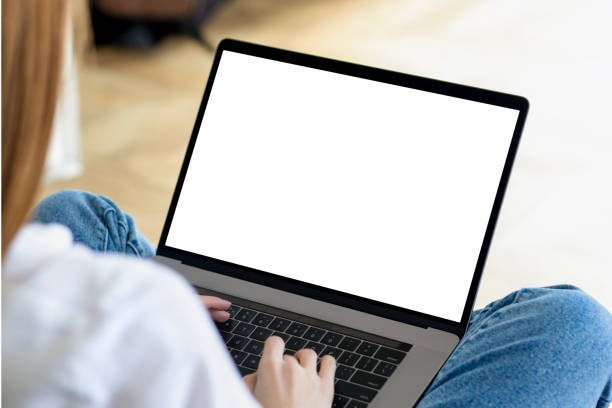 istock Young woman using laptop with blank screen. Female watching webinar, training or online works. Copy space, mock-up for your design or text 1488150532