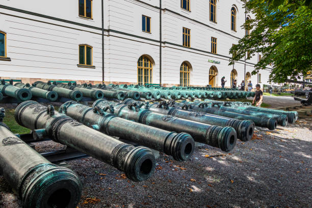 Many ancient iron cannons outside on cort yard. stock photo