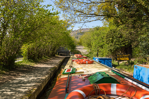 Llangollen, Dengighshire Wales - 21 April 2019: Narrow boats on the Llangollen Canal as it crosses the Pontcysyllte aquaduct, a world heritage site.