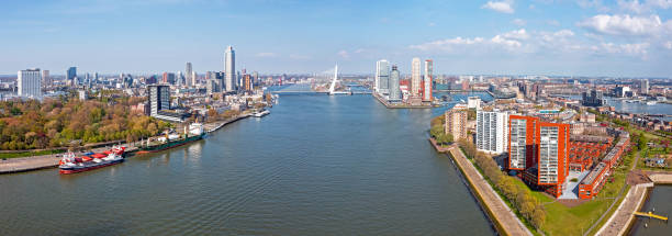 Aerial from the city Rotterdam with the Erasmus bridge in the Netherlands stock photo